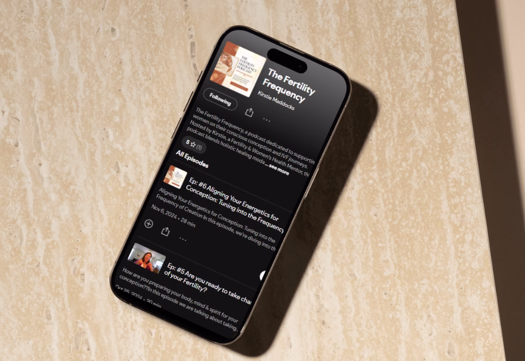 Smartphone displaying The Fertility Frequency podcast by Kirstie Maddocks, created after messaging strategy with Selena Woodward.