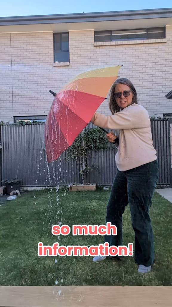 Biz Coach Selena holding an umbrella while water sprays from a hose, symbolizing overwhelming data and confusing messaging that drowns potential clients.